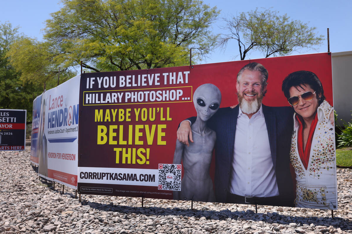 Signage for the Clark County Commission District F race between Albert Mack and Heidi Kasama is ...