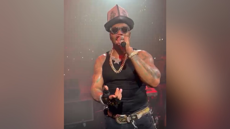 Kyrgyz fan presents traditional headwear to American rapper Flo Rida during Moscow concert
