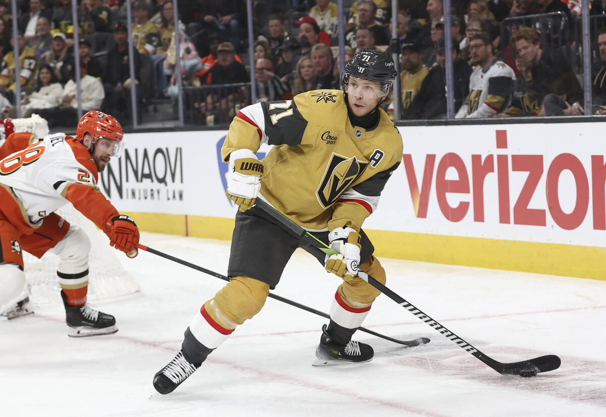 Golden Knights center William Karlsson (71) looks to clear the puck during the second period of ...