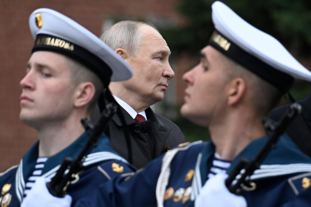 Russian President Vladimir Putin, centre foreground, attends a ceremony to lay flowers at the Tomb of the Unknown Soldier by the Kremlin wall inMoscow, Saturday, May 9, 2026, during celebrations of the 81st anniversary of the Soviet Union's victory over Nazi Germany during the World War II. (Alexander Nemenov/Pool Photo via AP)