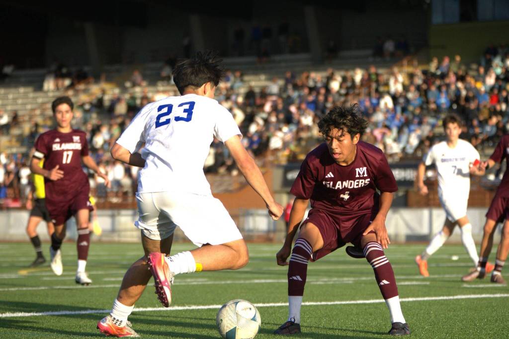 Shorewood’s Ian Baxter (left) dribbles against Mercer Island’s Jesus Aquino (right) during the 2026 class 3A boys soccer state championship game on Saturday, May 30, 2026 at Sparks Stadium in Puyallup. (Qasim Ali / The Herald)