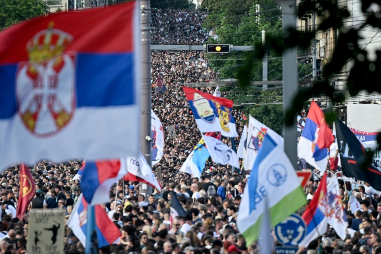 Tens of thousands rally in Serbian capital demanding elections