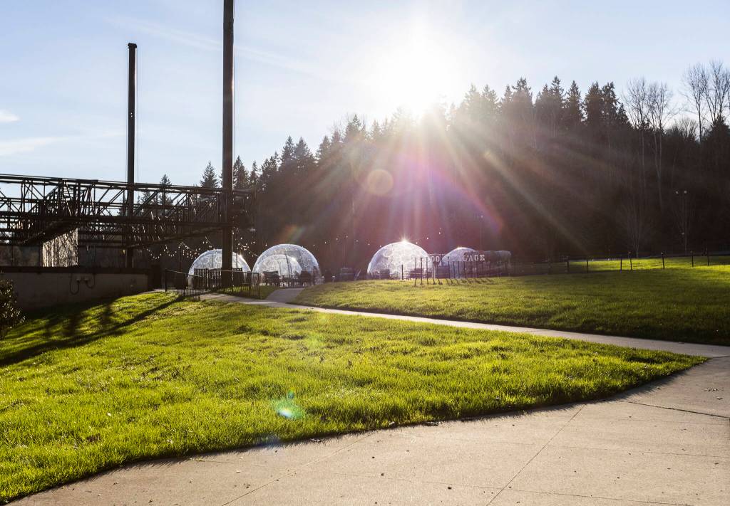 The sun shines through Chateau Ste. Michelle’s current set up of igloos on Jan. 21 in Woodinville, Washington. Forecasters say warm weather is on the way for Snohomish County. (Olivia Vanni / The Herald)