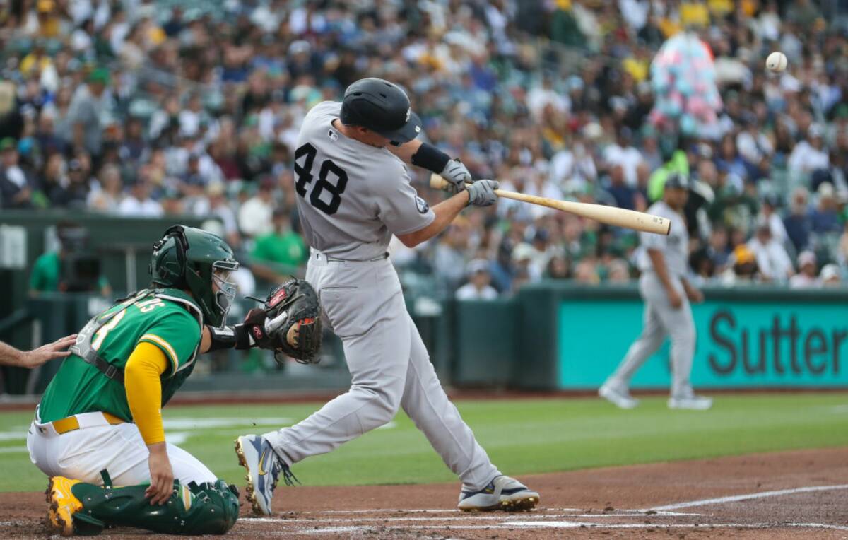 New York Yankees' Paul Goldschmidt hits a three-run home run during the first inning of a baseb ...