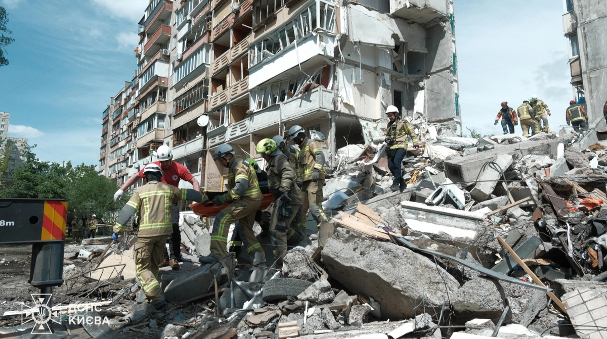 Young man helps rescue people from destroyed building in Kyiv