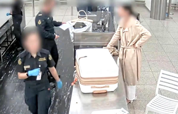 Another woman arrested off a flight from Thailand in late May smuggling dangerous drugs into Australia
