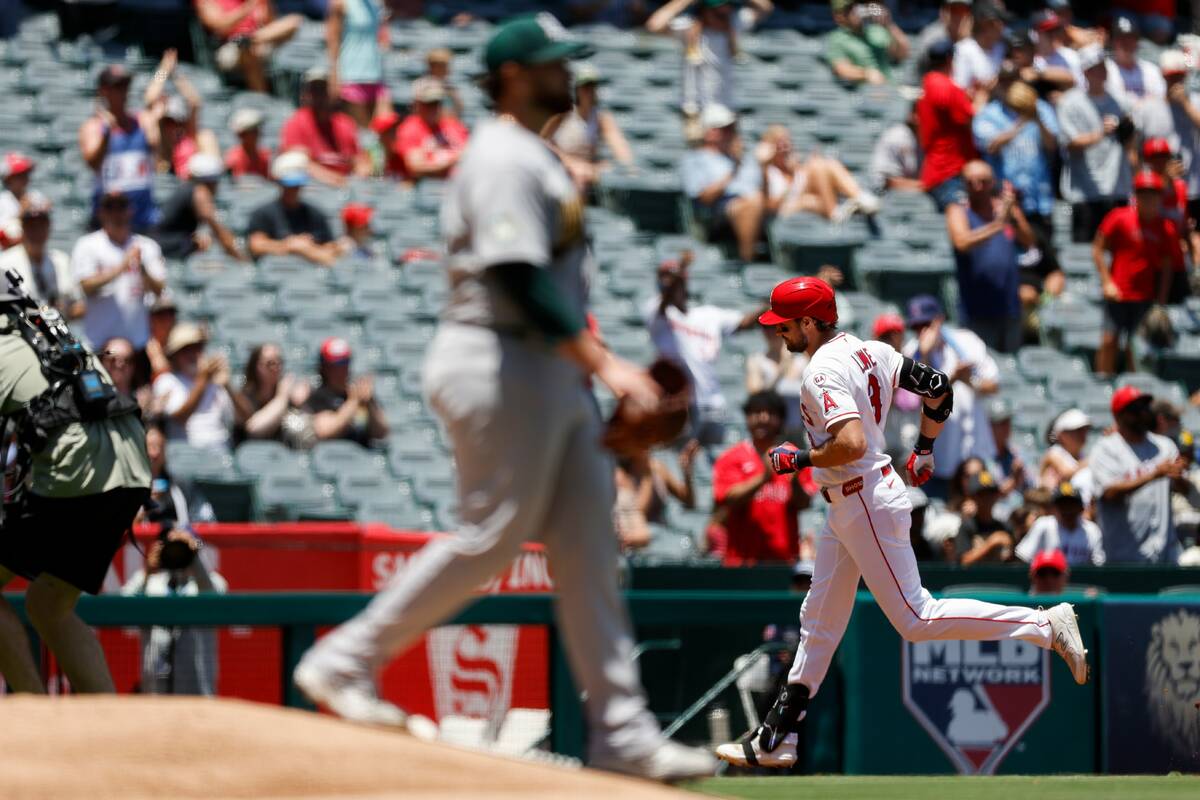 Los Angeles Angels' Josh Lowe, right, rounds the bases after hitting a grand slam as Athle ...