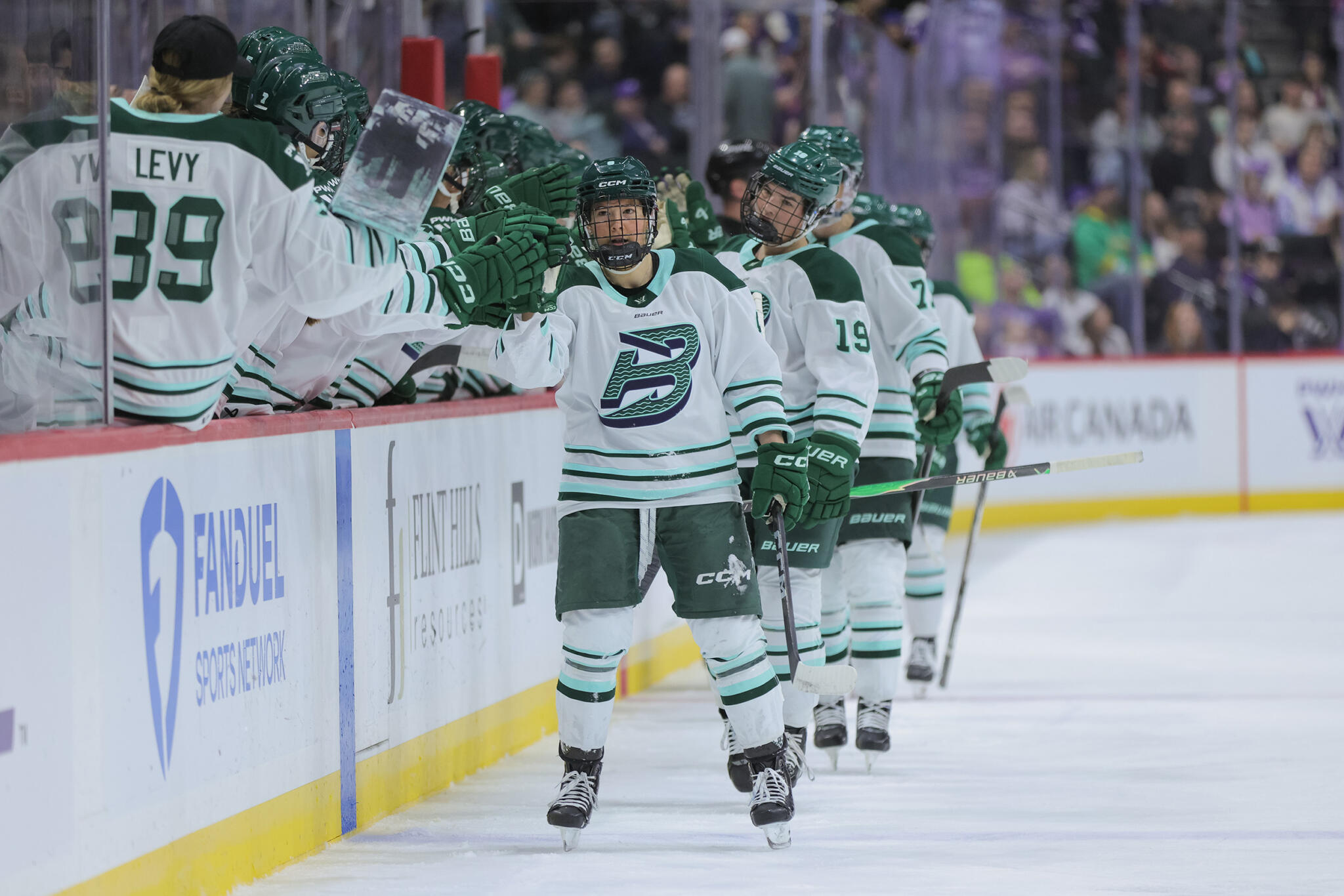 Boston Fleet right defenseman Haley Winn (8) is congratulated after scoring during the first period of a PWHL game between the Boston Fleet and Minnesota Frost on March 29th, 2026, at Grand Casino Arena in St. Paul, MN. (Bailey Hillesheim/Icon Sportswire via Getty Images)