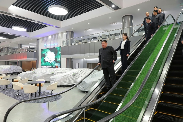 Kim Jong Un inspects service facilities in Pyongyang's Hwasong district Phase 4 development zone ahead of their opening, accompanied by officials including his wife Ri Sol Ju, in April 2026