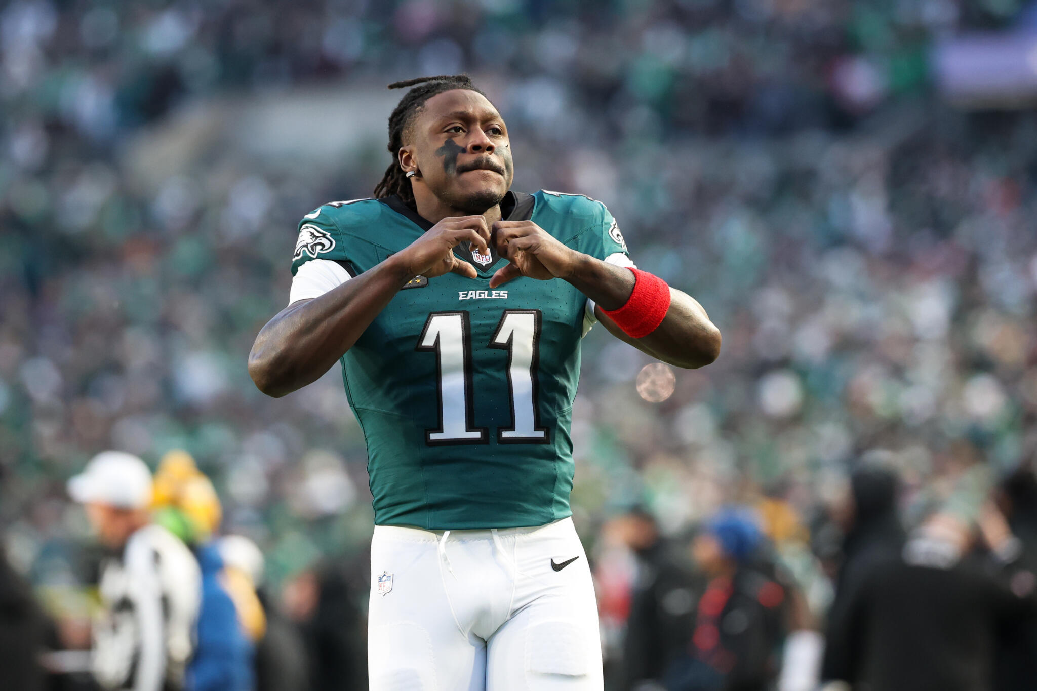 Philadelphia Eagles wide receiver A.J. Brown (11) gestures towards the crowd during pre-game warm-ups before an NFL wild card playoff football game against the San Francisco 49ers, Sunday, Jan. 11, 2026, in Philadelphia. (Terrance Williams/AP)