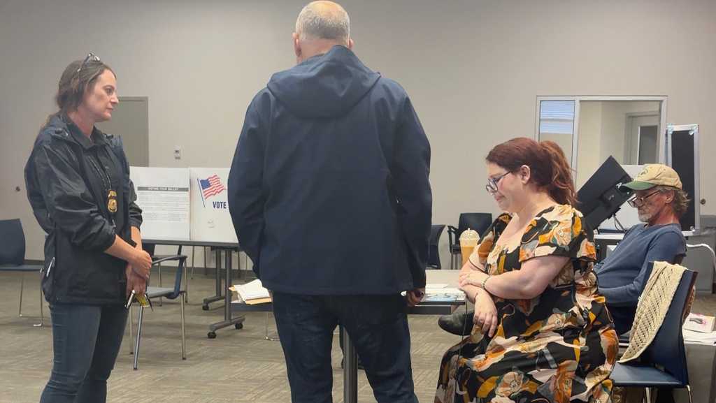 Election worker says federal officers confronted her at polls over social media post criticizing ICE