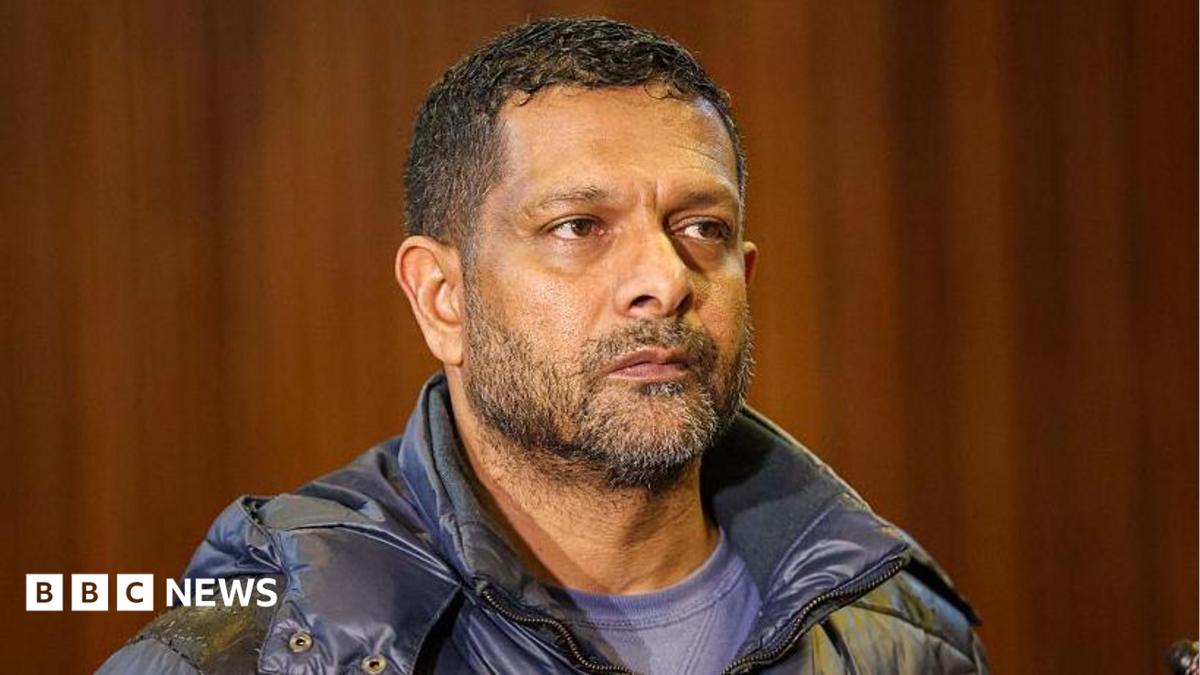 South Africa's deputy head of crime intelligence Feroz Khan is seen in court. He has short hair and a short beard