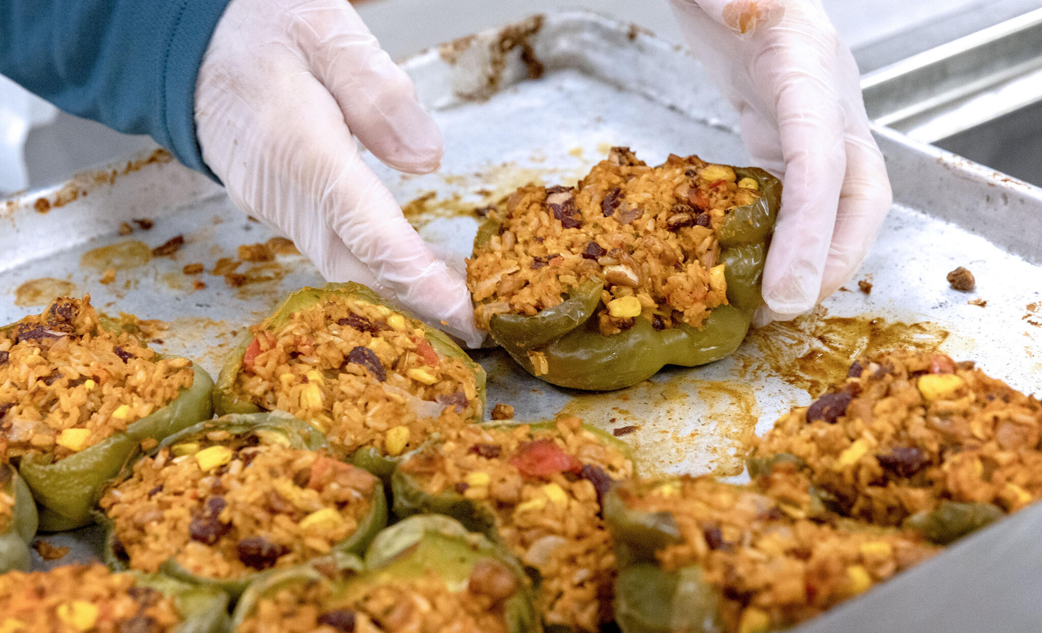 Volunteers prepare stuffed peppers at Community Servings in Jamaica Plain, on Jun. 1.