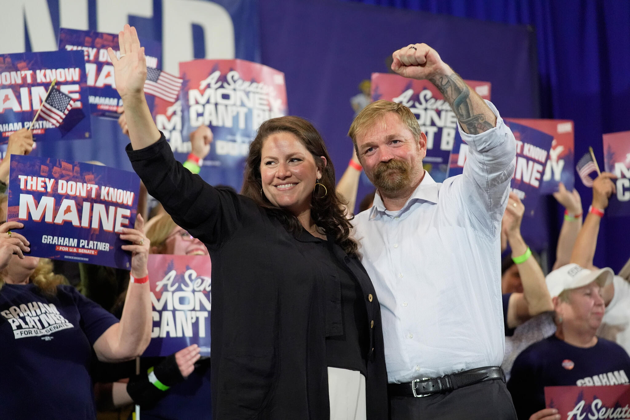 Democratic U.S. Senate candidate Graham Platner, right, and his wife Amy Gertner gesture to supporters during a primary election night watch party Tuesday, June 9, 2026, in Blue Hill, Maine. (Robert F. Bukaty/AP)