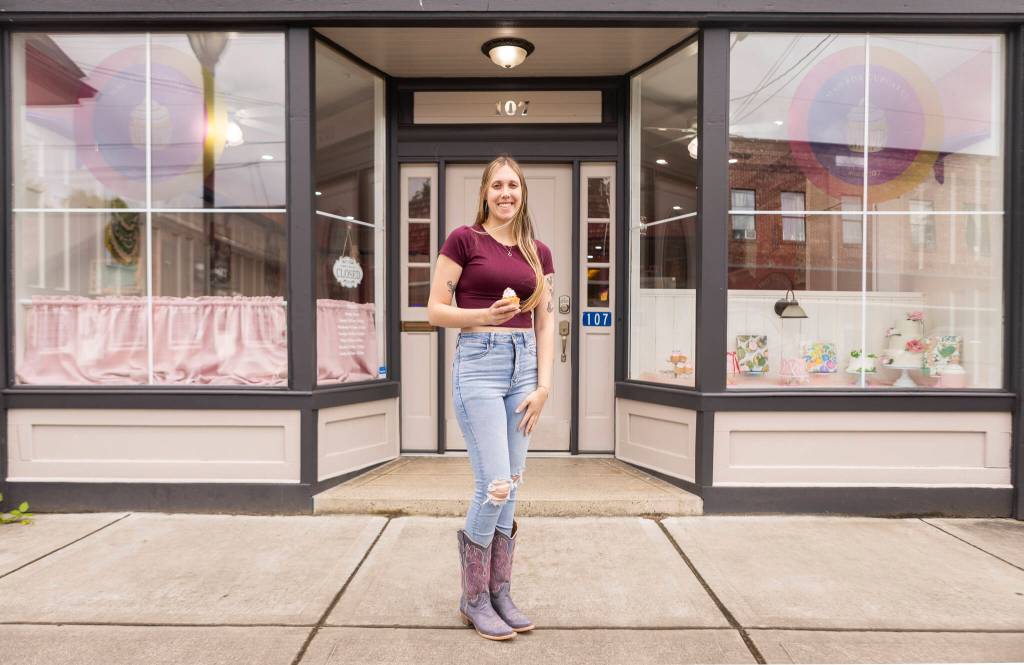 Madison Dennis, the owner of Mad For Cupcakes, outside of her new brick-and-mortar location on Friday, June 26, 2026 in Granite Falls, Washington. (Olivia Vanni / The Herald)