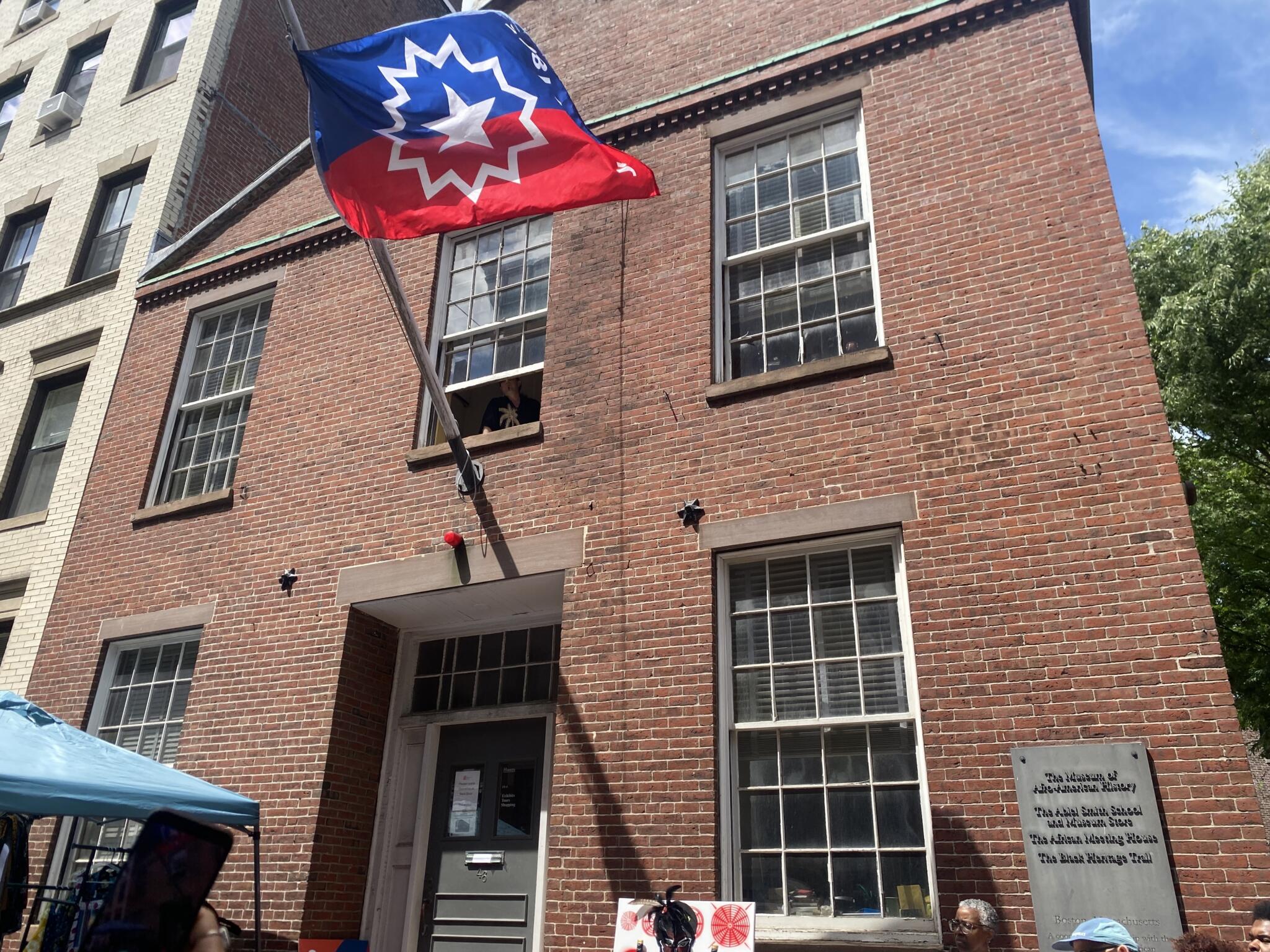 Crowds gather on Joy Street for a Boston Juneteenth celebration hosted by the Museum of African American History. WBUR/Suevon Lee