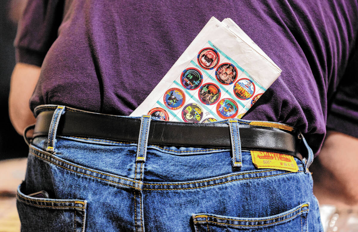 Rick Pokracki keeps a print out of the chips he needs for his collection as he combs through a ...