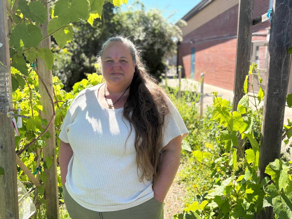 Sabrina Shaw stands in her students’ garden on Thursday, June 11, 2026, at the Sky Valley Education Center in Monroe. Her students nominated her National History Day Teacher of the Year. (Taylor Scott Richmond / The Herald)