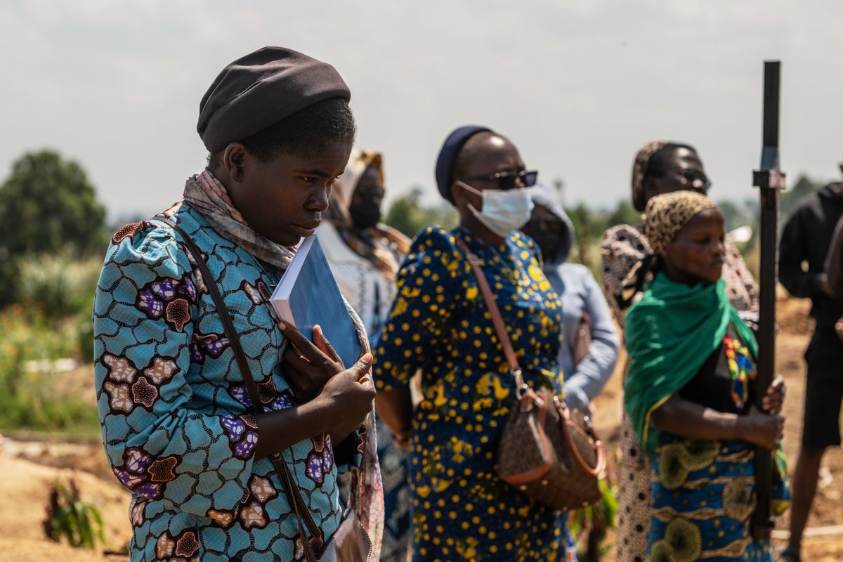 Mourners bury a 6-month-old Ebola victim, marking third orphanage death as Congo outbreak spreads