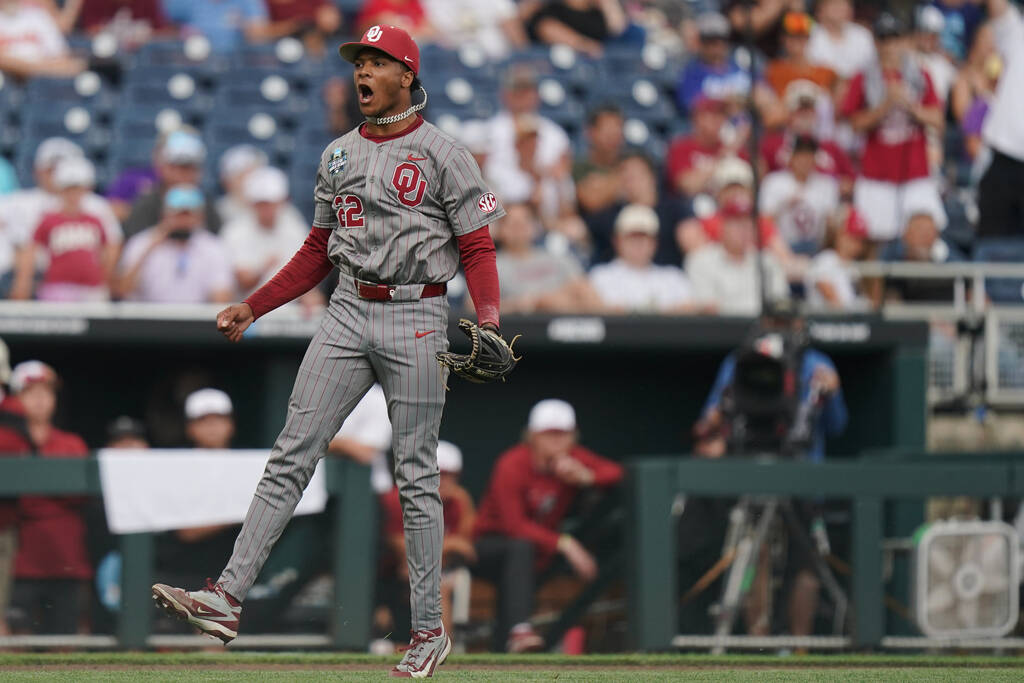 Oklahoma pitcher Lj Mercurius (22) celebrates after an NCAA baseball College World Series game ...