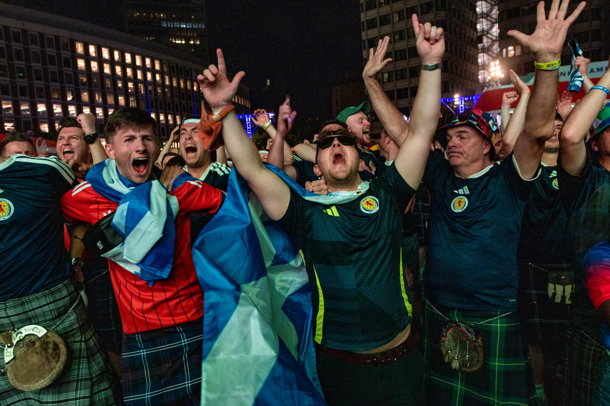 Scottish fans at the FIFA Fan Festival Boston at City Hall Plaza rejoice as their team defeats Haiti 1-0 during the World Cup game at Foxborough. (Jesse Costa/WBUR)
