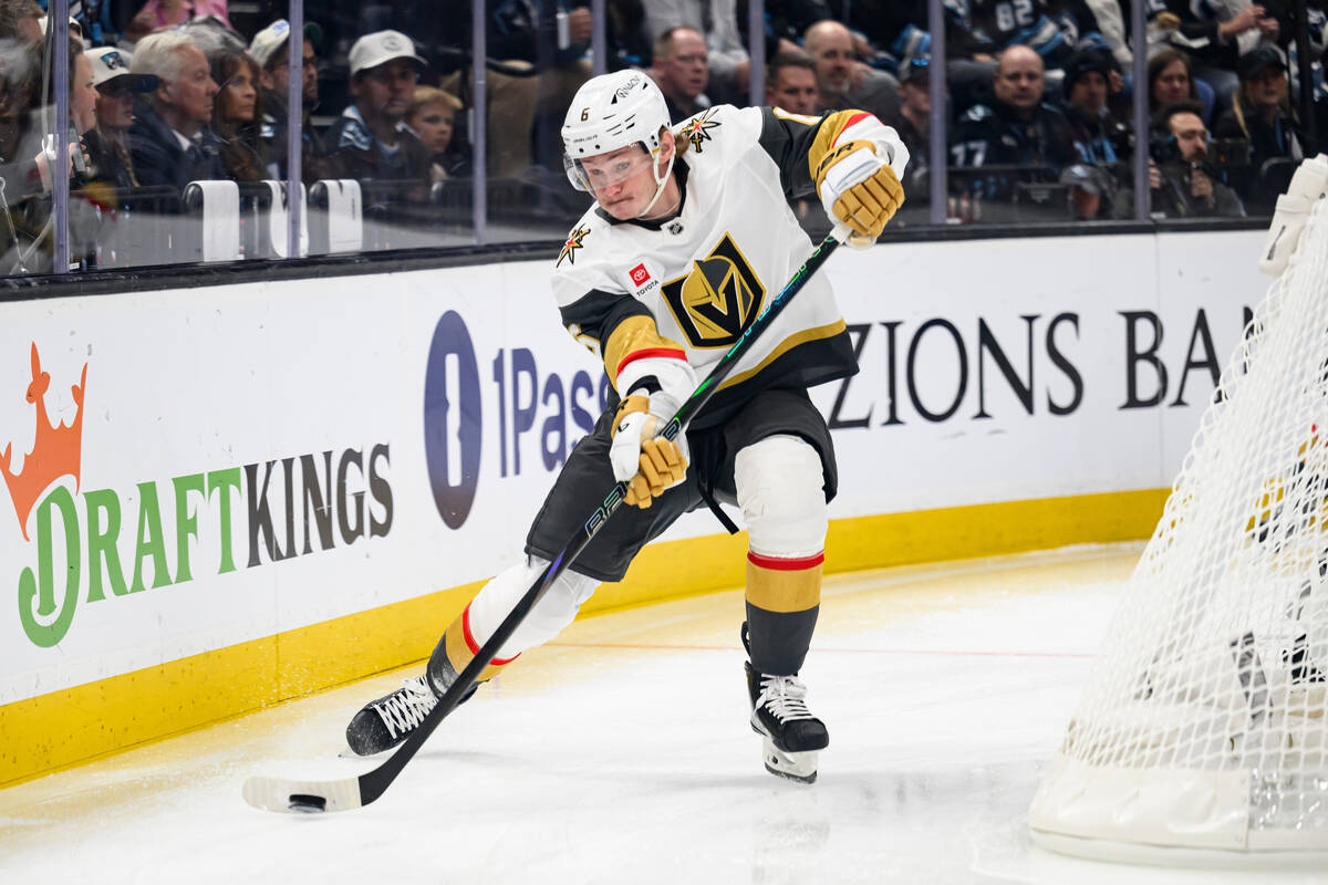 Vegas Golden Knights defenseman Kaedan Korczak plays the puck off the boards during the first p ...