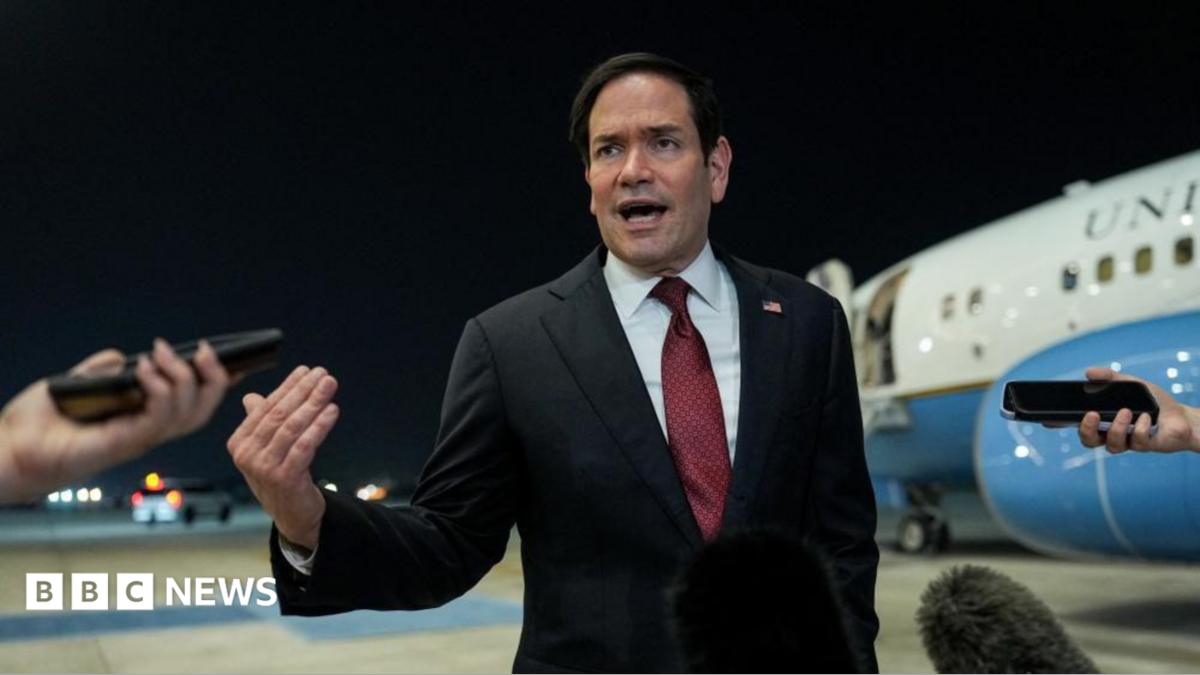 Secretary of State Marco Rubio speaking to reporters after landing in Abu Dhabi