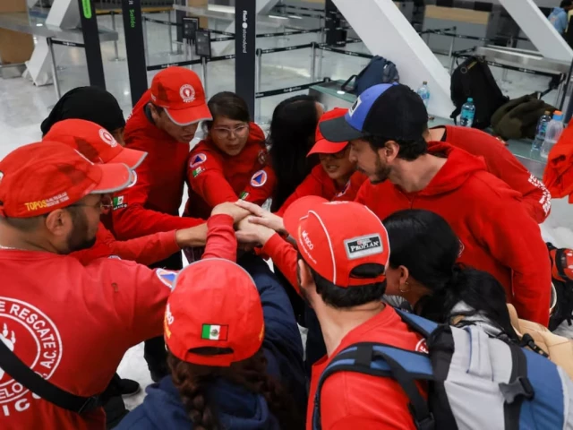 members of the mexican rescue team known as the topos tlatelolco rescue brigade huddle as they prepare to depart for venezuela following two earthquakes at benito juarez international airport in mexico city mexico june 26 2026 reuters