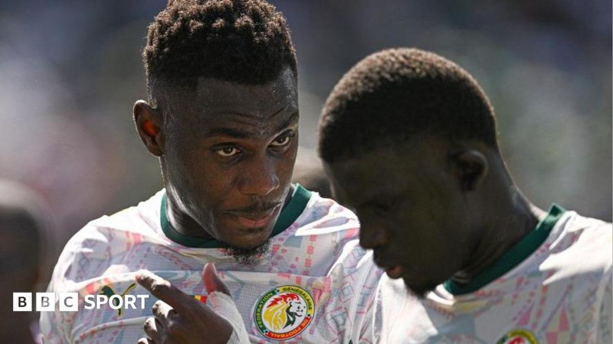 Senegal's Moussa Niakhate talks with team-mate El Hadji Malick Diouf during the group game with France at the 2026 World Cup