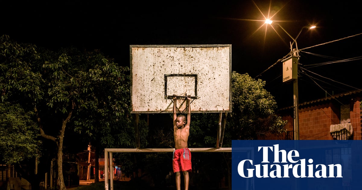 A boy clowning around on a basketball court in a Colombian cocaine corridor: Mads Nissen’s best photograph | Photography