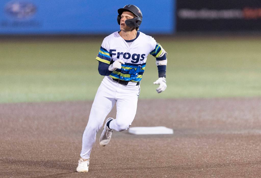 Josh Caron (10) of the Everett AquaSox runs toward third base during the game against the Tri-City Dust Devils on Tuesday, April 7, 2026 in Everett, Washington. (Olivia Vanni / The Herald)