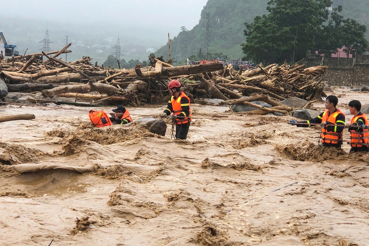 At least 12 dead in heavy rains across southern China and Vietnam