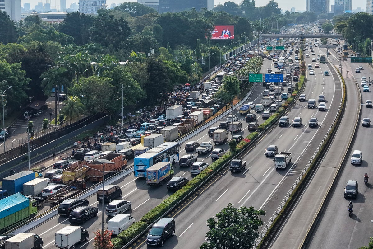 At least 13 killed after truck carrying wedding guests crushed on Indonesia highway
