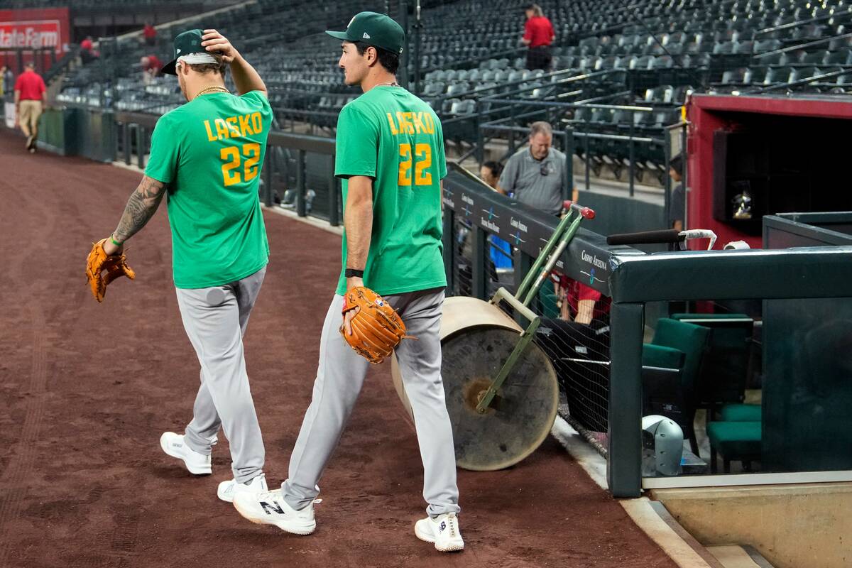 Athletics' Tommy White, left, and Alika Williams wear a Lasko No. 22 t-shirt in honor of i ...