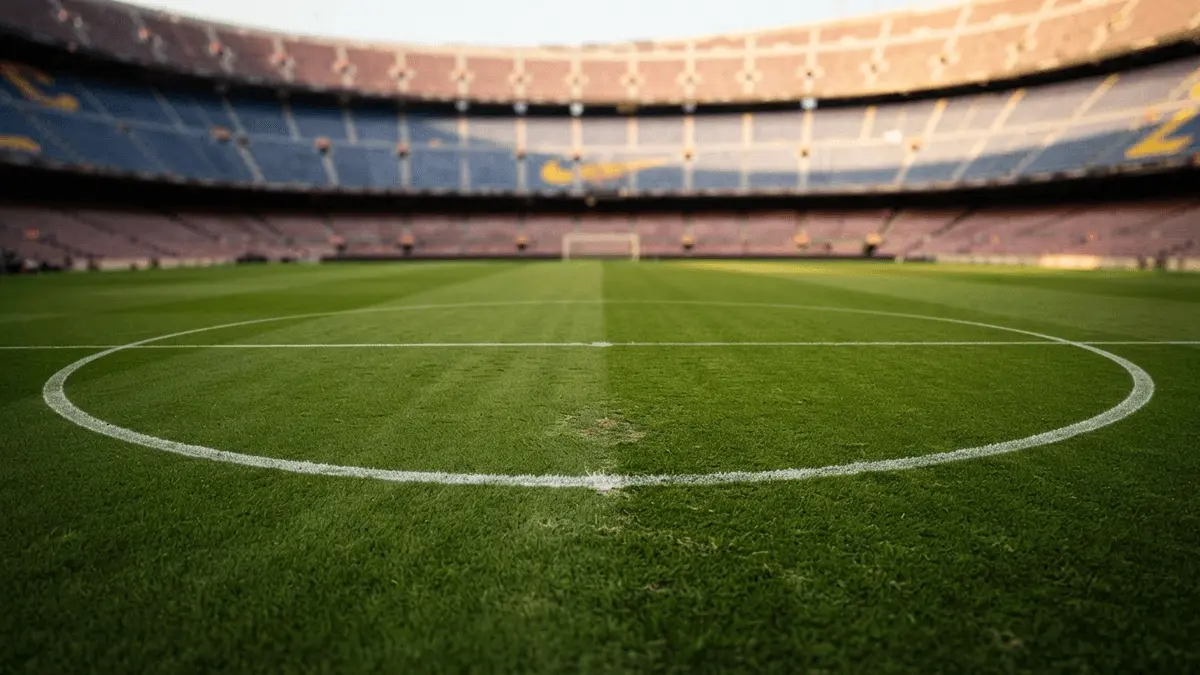 Empty midfield position on FC Barcelona pitch highlighting transfer market search