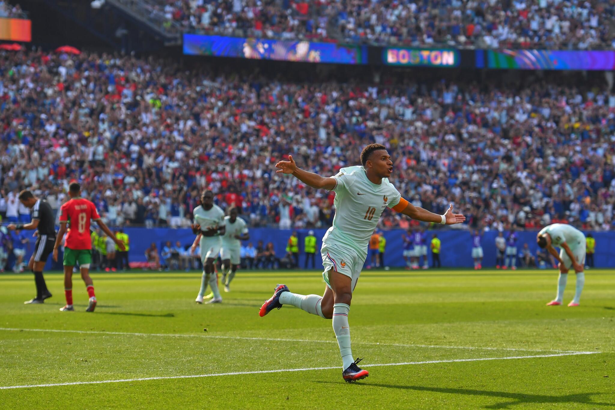 France's Kylian Mbappe celebrates scoring the opening goal during the World Cup quarterfinal soccer match between France and Morocco in Foxborough. (Steven Senne/AP)