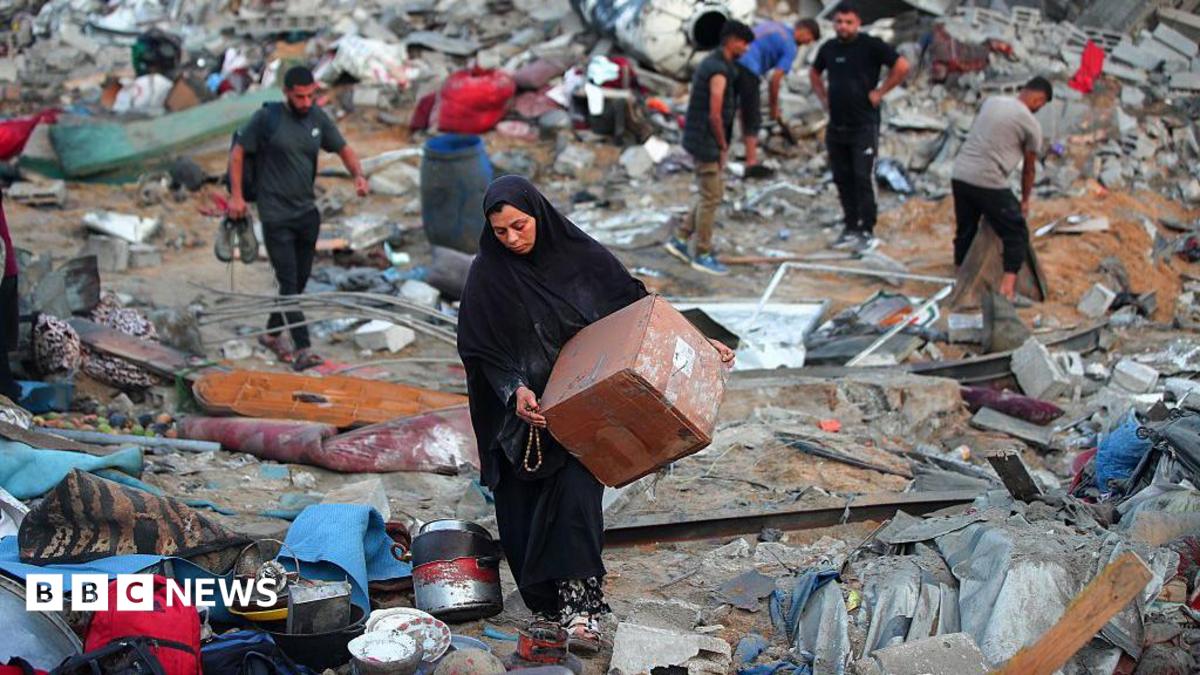 A Palestinian man rests amid debris at the site of an Israeli strike on a house in Gaza City, on July 30, 2026.
