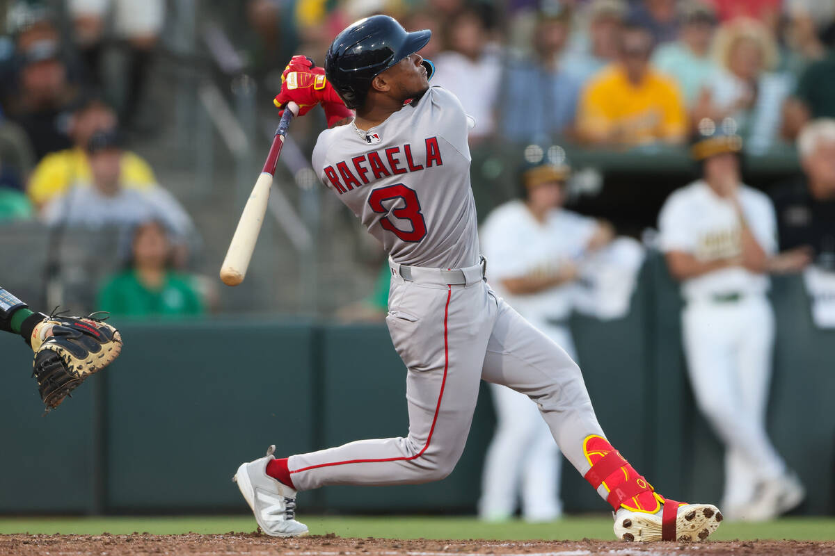 Boston Red Sox's Ceddanne Rafaela watches his grand slam during the sixth inning of a base ...