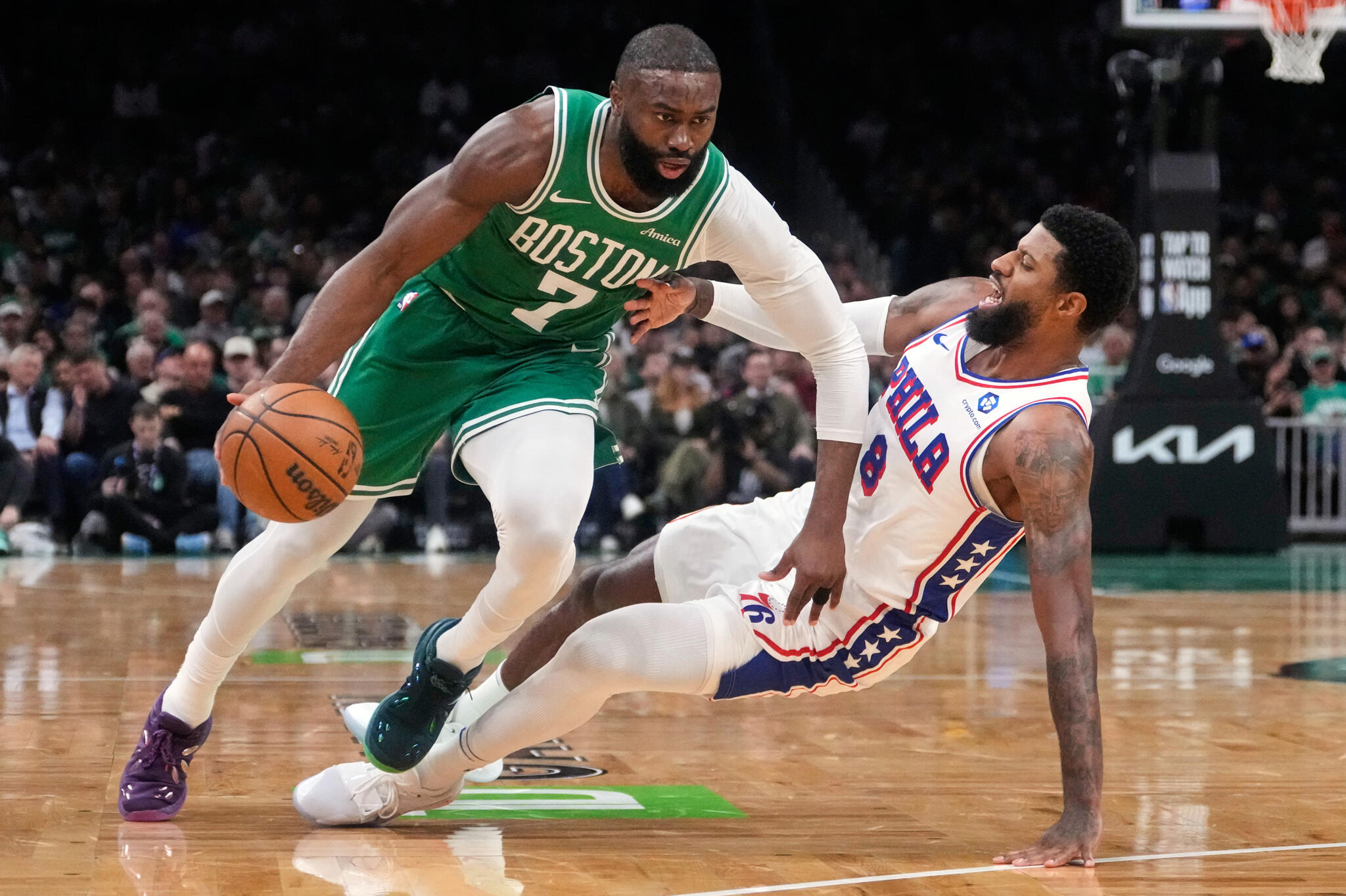 Boston Celtics guard Jaylen Brown (7) drives to the basket against Philadelphia 76ers forward Paul George (8) during the first half of Game 2 of a first-round NBA playoffs basketball series, April 21, 2026, in Boston. (Charles Krupa/AP, File)