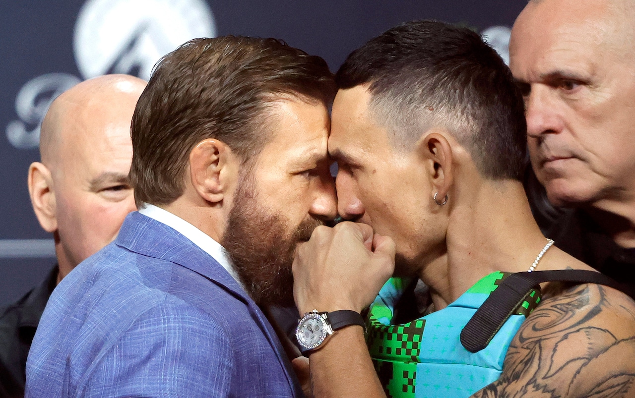 UFC fighters Conor McGregor and Max Holloway butt heads during a press conference leading up to their fight at UFC 329.