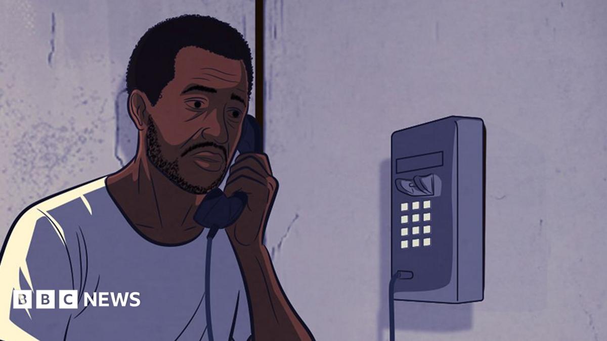 An illustration of a man on a wall-mounted telephone. He is wearing a white T-shirt and orange trousers. Some prison bars can be seen on the left of the image.