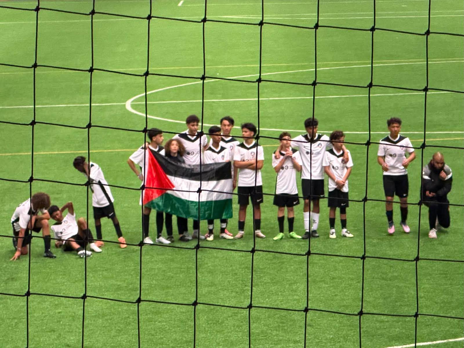 Players from FC Vaujours display a Palestinian flag during the Tallinn Cup under-14 tournament in Tallinn. Photo courtesy of Kert Valdaru.
