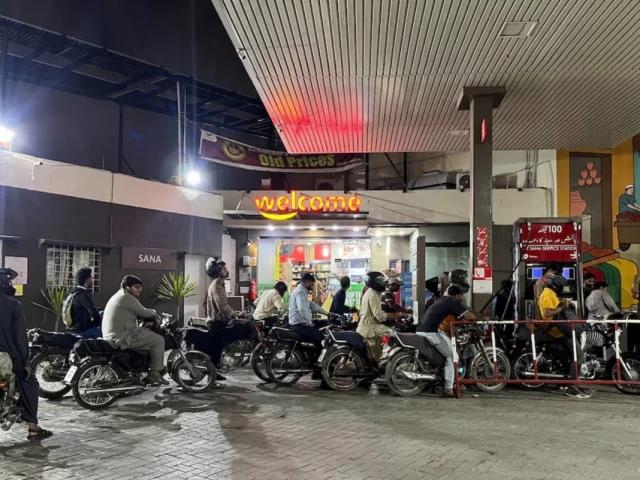 people on their motorbikes wait for their turn to get fuel at a petrol station hours before fuel prices are raised in pakistan amid the u s  israeli conflict with iran in karachi pakistan april 30 2026 picture taken with a mobile phone reuters