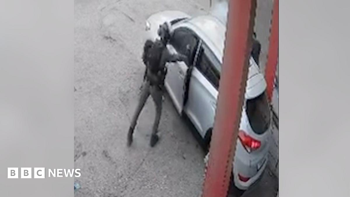 Screengrab of video released by Israeli human rights group B'Tselem showing smoke coming out of a car after an Israeli Border Police officer threw a stun grenade inside, in Qalandia refugee camp, in the occupied West Bank
