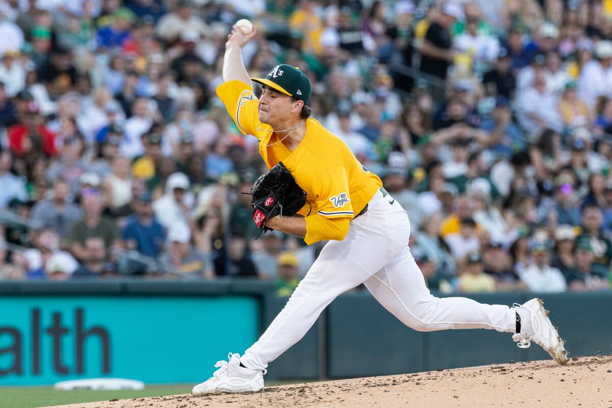 Athletics pitcher J.T. Ginn throws to the Washington Nationals during the second inning of a ba ...