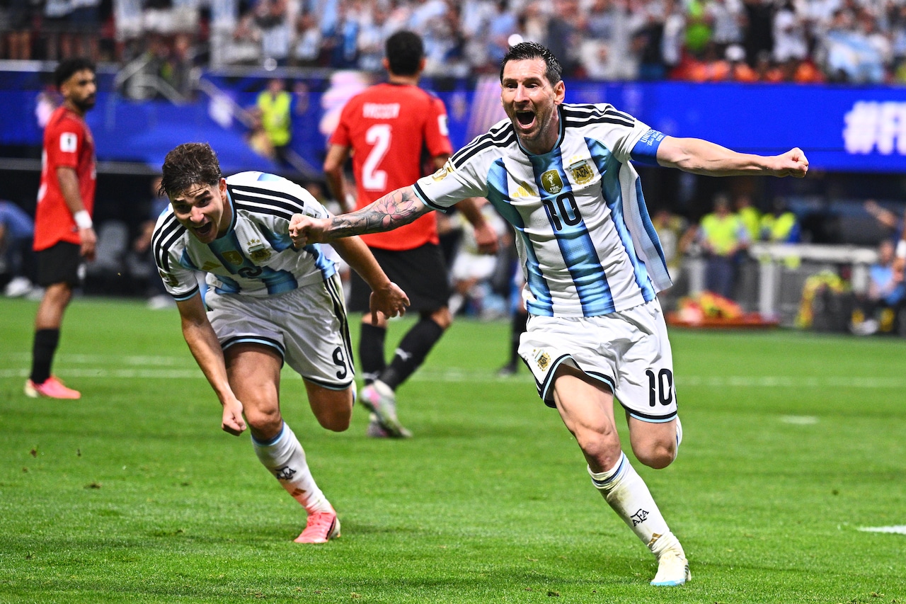 Argentina's Lionel Messi sprints down the field in celebration following a goal during a World Cup round of 16 match against Egypt.