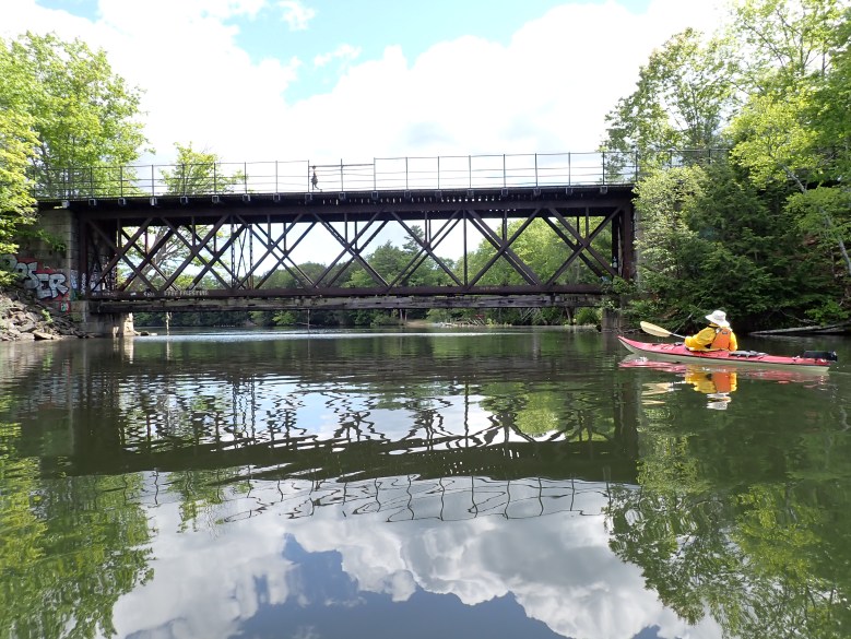 Kayakers explore historic Presumpscot River on a hot summer day