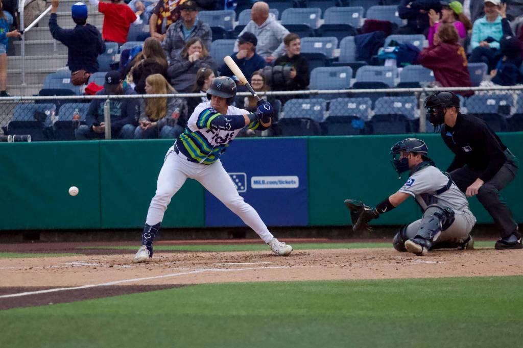 AquaSox catcher Luke Stevenson tries to avoid an inside pitch during Everett’s 3-2 win against the Tri-City Dust Devils at Everett Memorial Stadium on June 30, 2026. (Joe Pohoryles / The Herald)