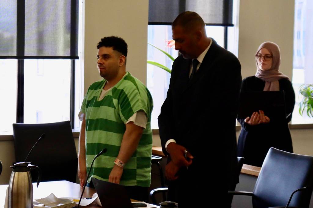 Kevin Rodriguez (left) stands with his defense attorney Karim Merchant during a sentencing hearing in Snohomish County Superior Court on July 9, 2026 in Everett, Washington. (Ian Davis-Leonard / The Herald)