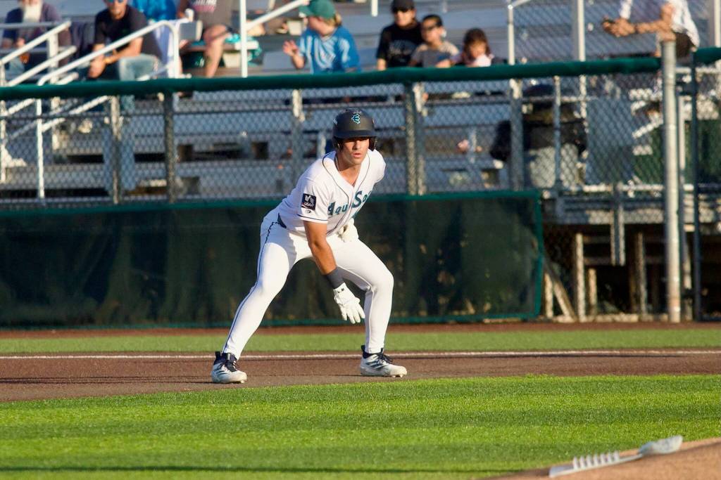 AquaSox infielder Brandon Eike takes a lead off first base during Everett’s 13-8 loss to the Eugene Emeralds at Everett Memorial Stadium on July 21, 2026. (Joe Pohoryles / The Herald)